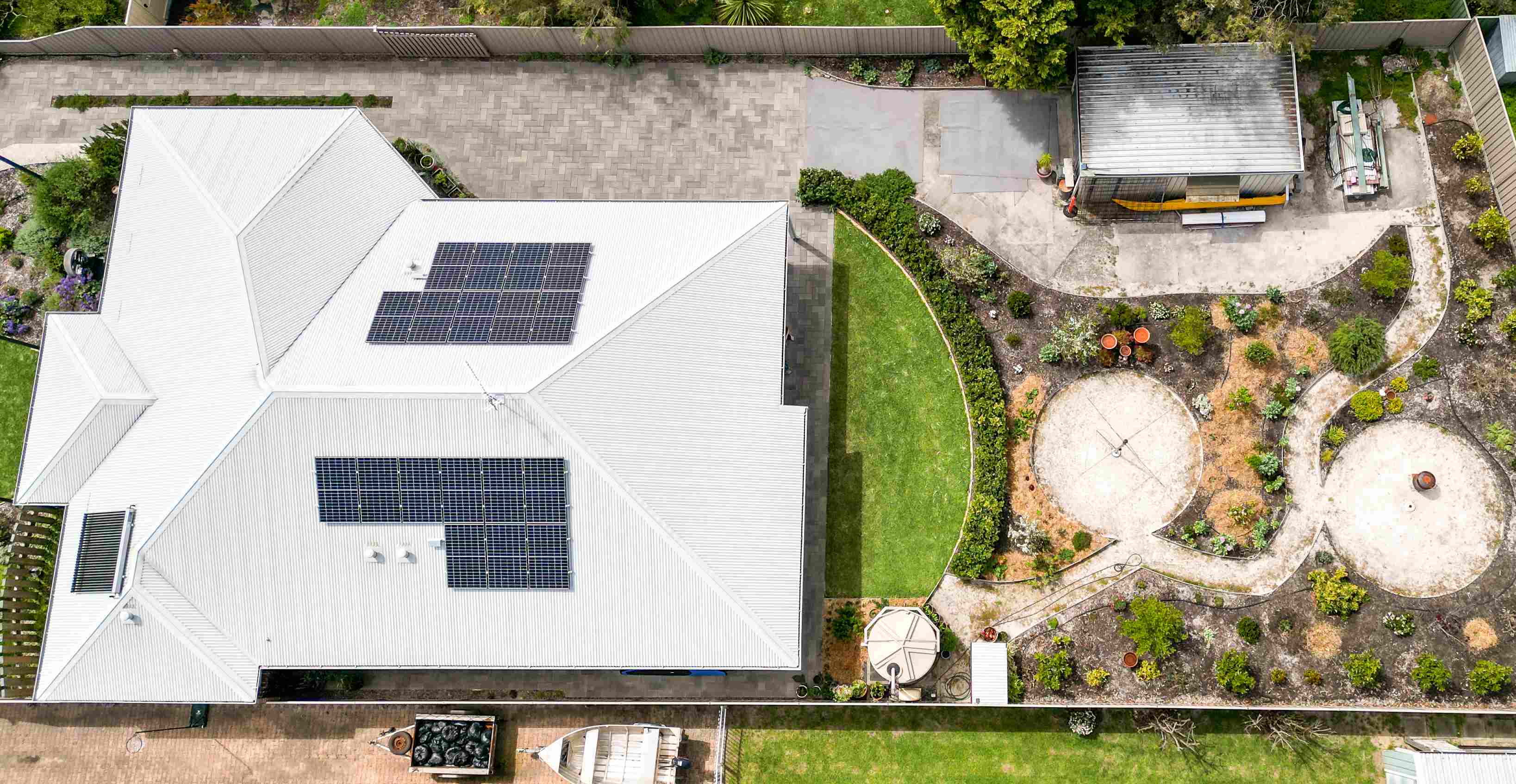 Aerial image of residential home with solar panels on roof