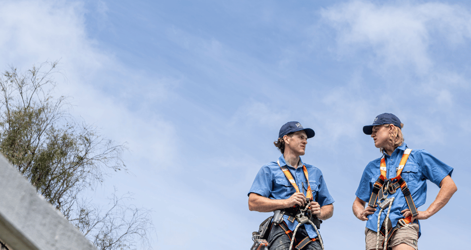 Plico solar panel installers on roof in Busselton Western Australia wearing harness