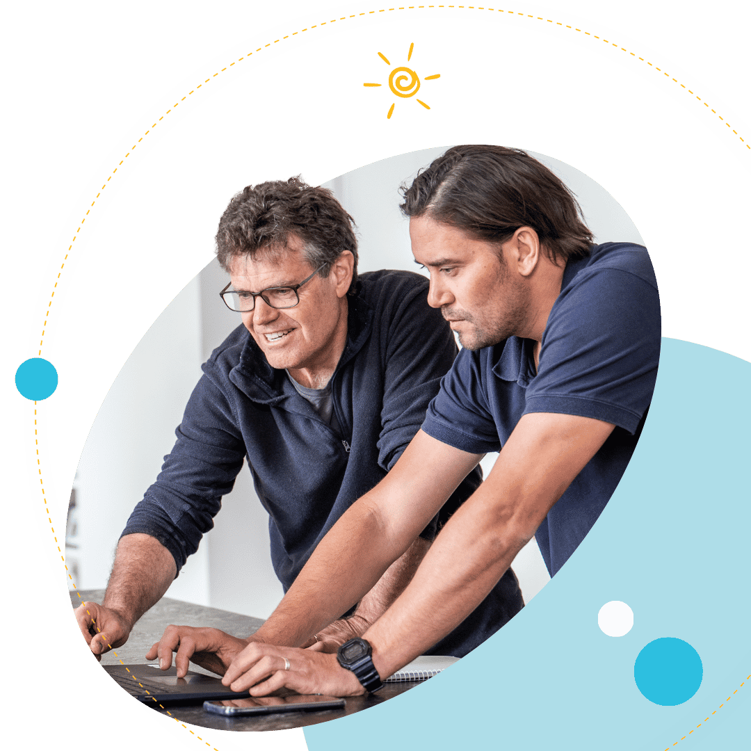 Plico member with Project Manager looking at laptop