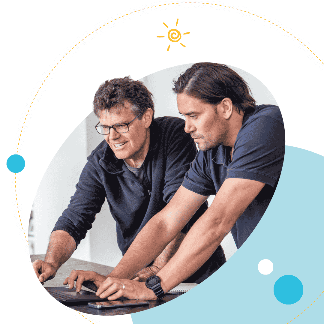 Customer at laptop with Plico team member