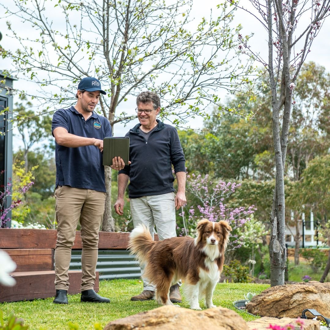 Plico staff member with customer and dog Plico staff member with customer and dog