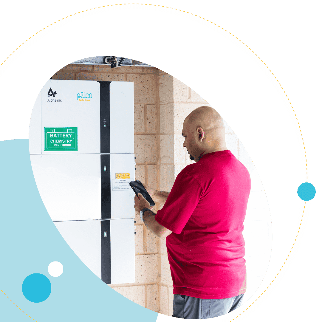 Man with solar battery in garage