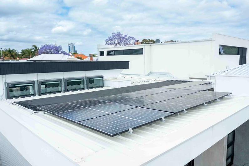 Close-up photo of solar panels installed on residential roof.