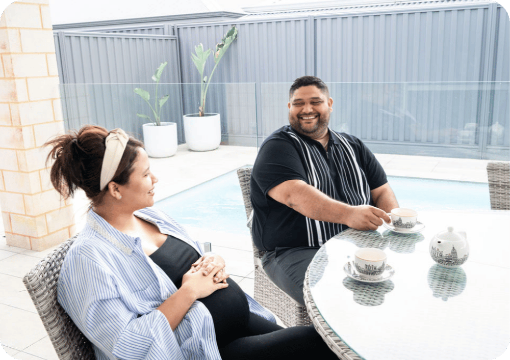 Woman and man at table laughing