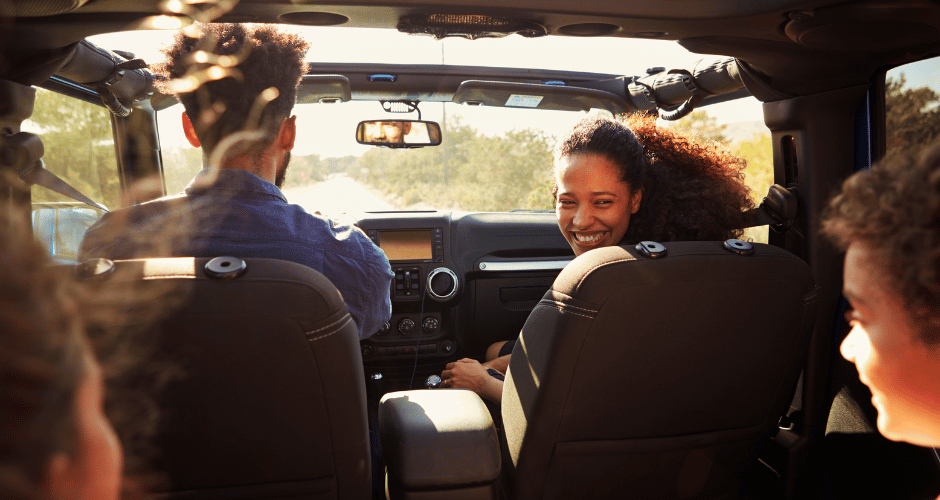 Family of four driving in a car