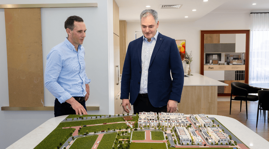 Stockland Robbie Thomas (2)Stockland's Thomas Hayes with Plico CEO Robbie Campbell with a model of the Nara site