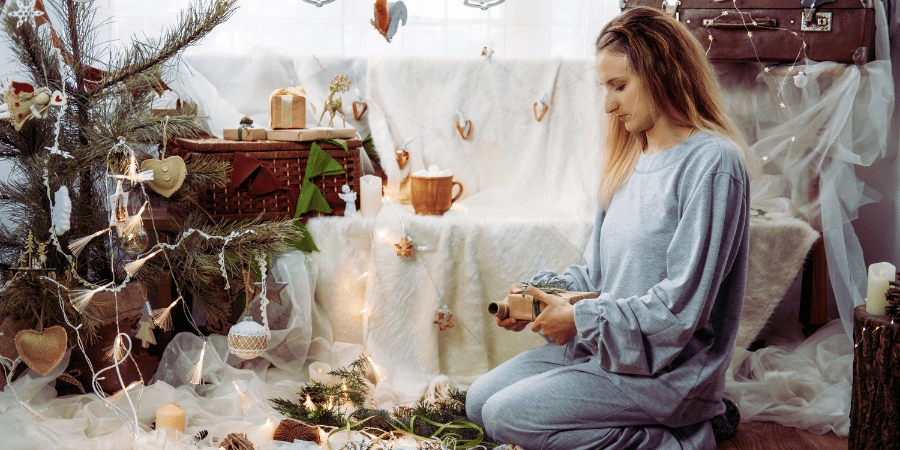 A woman wrapping Christmas presents