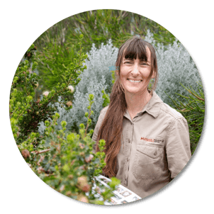 Woman with native trees round