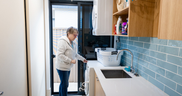 Woman with washing machine